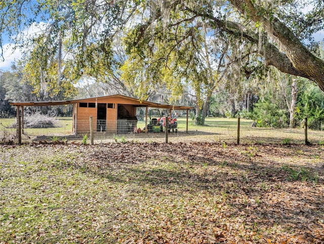 exterior space with a carport and an outdoor structure