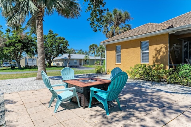 view of patio with an outdoor fire pit