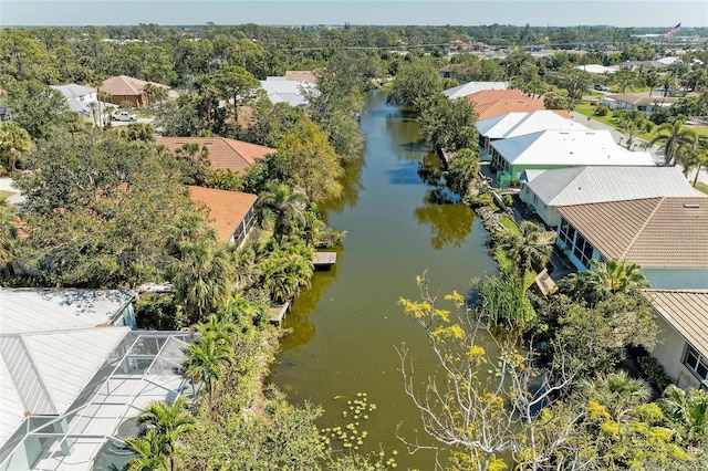 drone / aerial view featuring a water view and a residential view