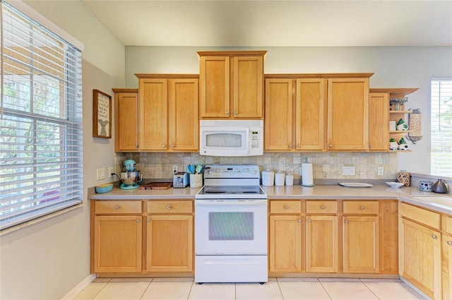 kitchen with white appliances, decorative backsplash, open shelves, and light countertops