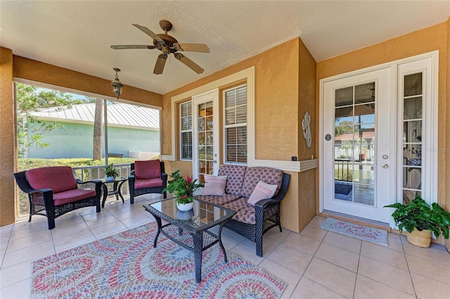 sunroom with ceiling fan