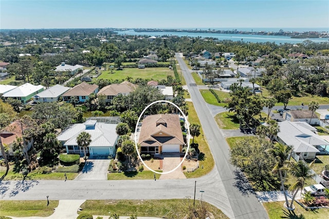 bird's eye view with a residential view and a water view