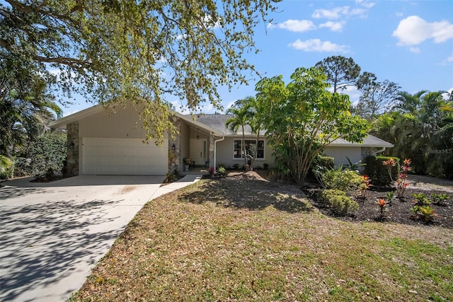 ranch-style home with driveway and an attached garage