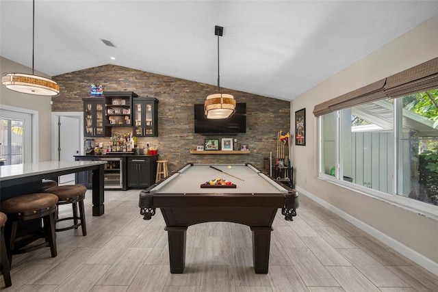 playroom with a bar, vaulted ceiling, beverage cooler, and a healthy amount of sunlight