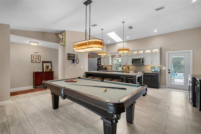 playroom featuring visible vents, baseboards, and vaulted ceiling