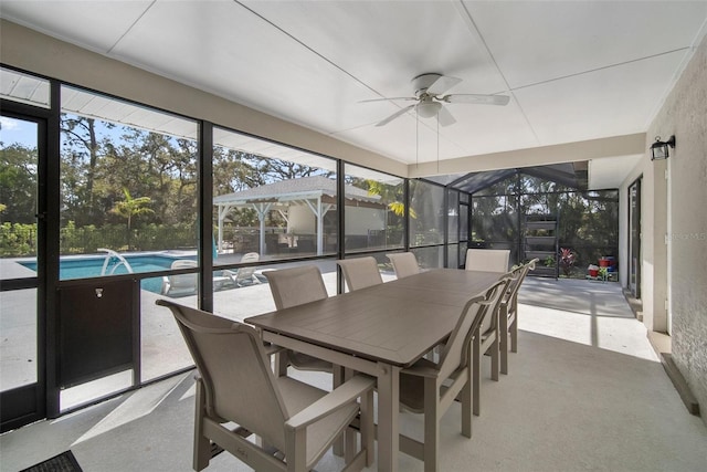 sunroom with a ceiling fan