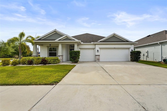 view of front facade with stucco siding, a garage, concrete driveway, and a front yard