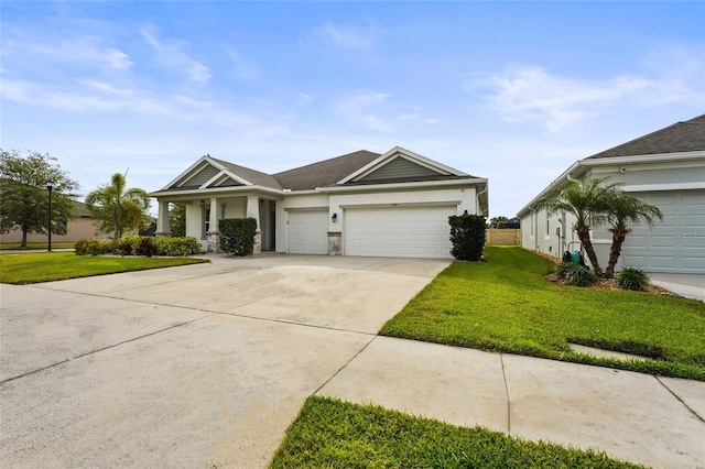 view of front of home featuring a front lawn, stucco siding, a garage, and concrete driveway
