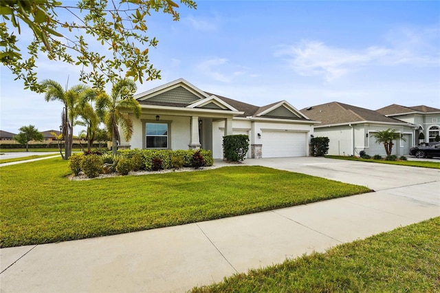 view of front of home featuring a front lawn, driveway, stucco siding, and an attached garage
