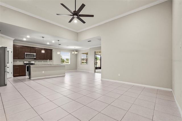 unfurnished living room featuring baseboards, crown molding, light tile patterned floors, and ceiling fan with notable chandelier