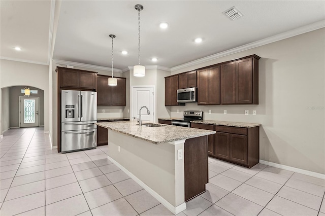 kitchen featuring a sink, dark brown cabinetry, appliances with stainless steel finishes, and visible vents