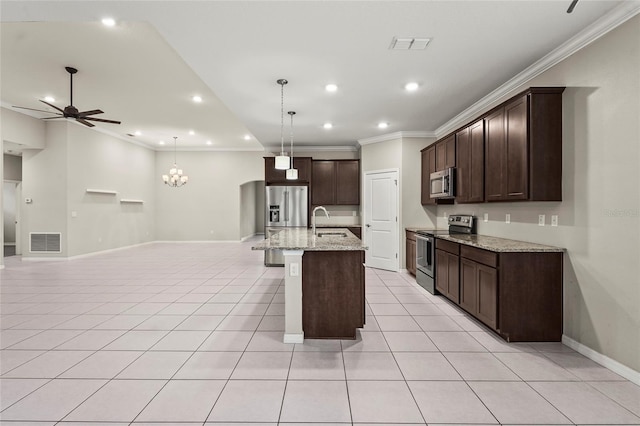 kitchen featuring visible vents, appliances with stainless steel finishes, a sink, ceiling fan with notable chandelier, and light tile patterned floors