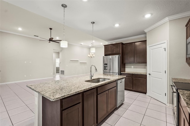 kitchen featuring a sink, stainless steel appliances, crown molding, and light tile patterned flooring