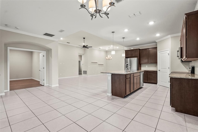 kitchen featuring light tile patterned flooring, open floor plan, stainless steel appliances, a kitchen island with sink, and ornamental molding