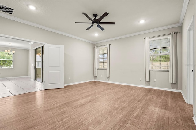 empty room with ornamental molding, visible vents, ceiling fan with notable chandelier, and light wood finished floors