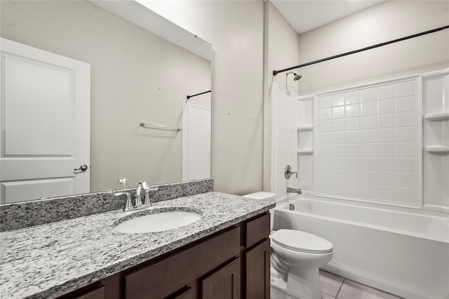bathroom featuring toilet, tile patterned floors, vanity, and bathing tub / shower combination