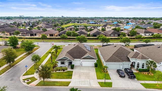 birds eye view of property with a residential view