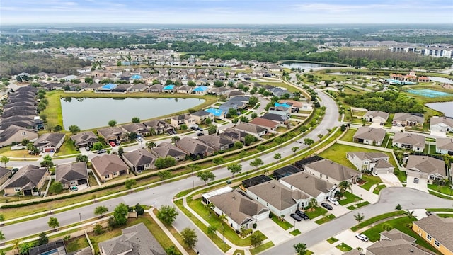 aerial view with a residential view and a water view