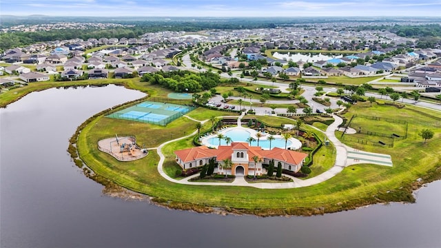 drone / aerial view with a residential view and a water view