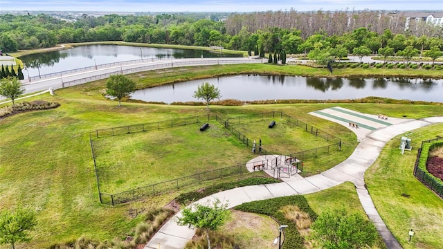 aerial view featuring a water view and a forest view