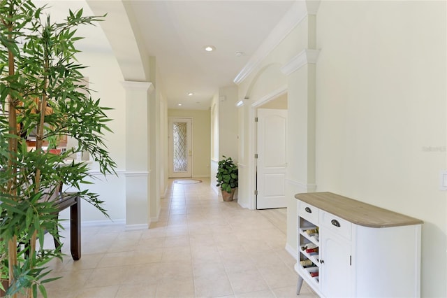 hall with decorative columns, recessed lighting, baseboards, and light tile patterned flooring