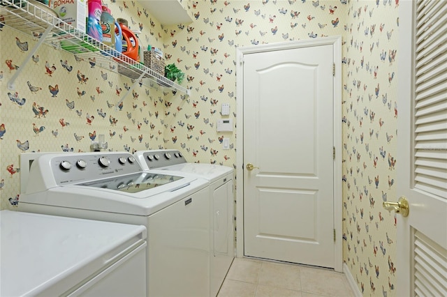 laundry room with washing machine and dryer, laundry area, and wallpapered walls