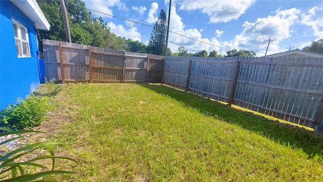 view of yard featuring a fenced backyard