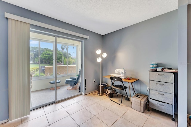 home office featuring a textured ceiling and light tile patterned floors