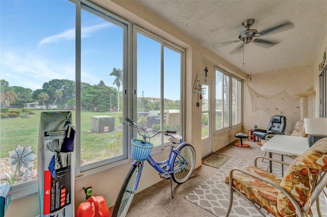 sunroom with a ceiling fan