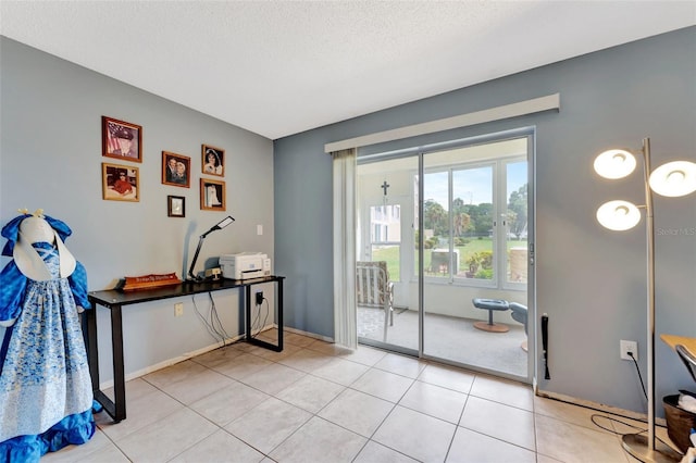 doorway featuring light tile patterned flooring and a textured ceiling