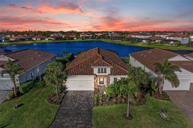 bird's eye view featuring a residential view and a water view