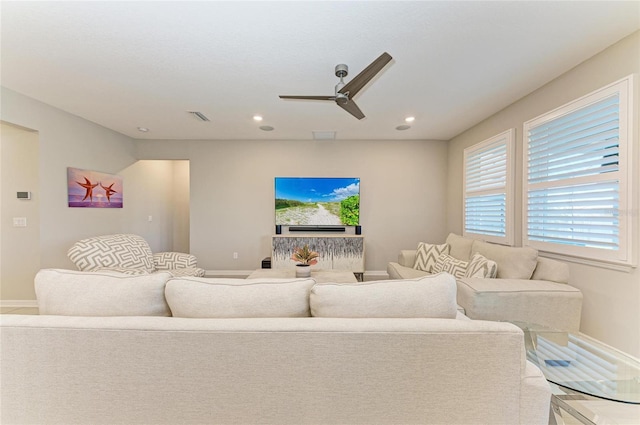 living area with recessed lighting, visible vents, baseboards, and a ceiling fan