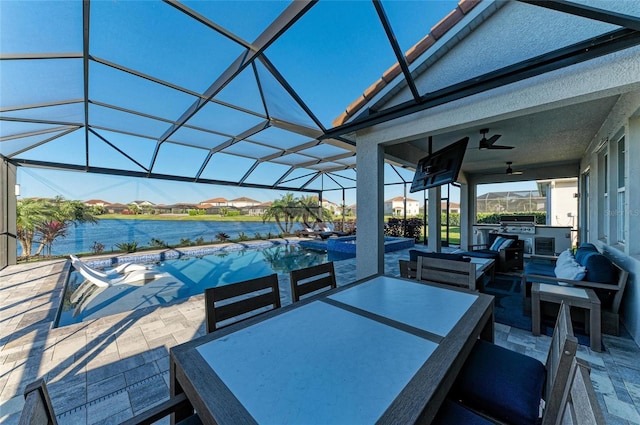 view of patio with outdoor dining area, ceiling fan, a water view, outdoor lounge area, and a lanai