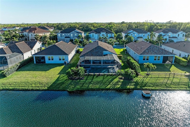 aerial view with a residential view and a water view