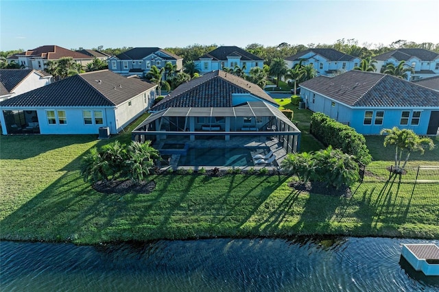 drone / aerial view featuring a residential view and a water view