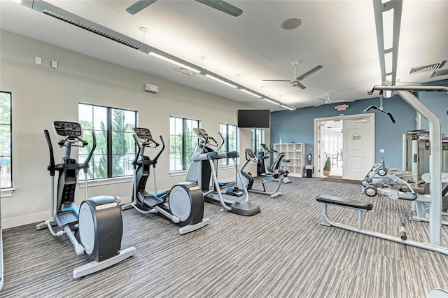 gym featuring visible vents, baseboards, carpet, and a ceiling fan