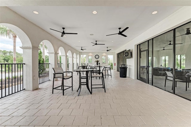 view of patio / terrace with outdoor dining area and ceiling fan