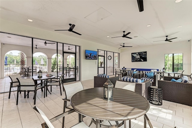 dining area featuring light tile patterned floors, recessed lighting, and a healthy amount of sunlight