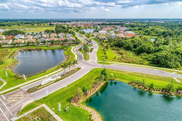 aerial view featuring a residential view and a water view