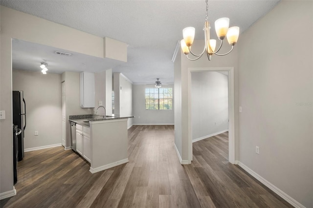 kitchen with dishwasher, dark wood-style flooring, visible vents, and white cabinets