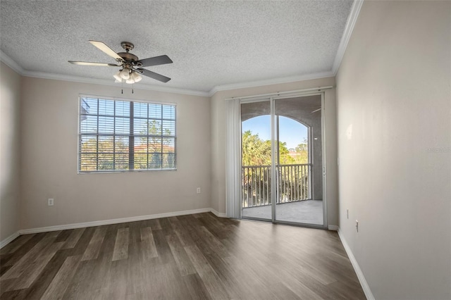 unfurnished room featuring ornamental molding, plenty of natural light, and wood finished floors