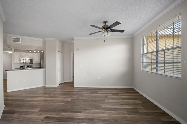 unfurnished living room featuring visible vents, dark wood-type flooring, and crown molding