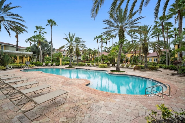 community pool featuring a patio area