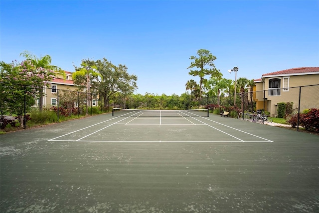 view of sport court with fence