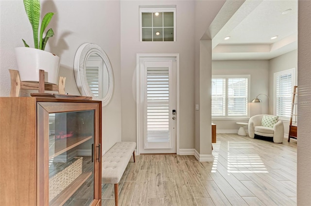 entrance foyer featuring recessed lighting, baseboards, and wood finished floors