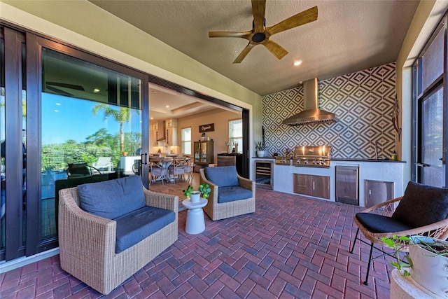 view of patio featuring a grill, beverage cooler, and exterior kitchen