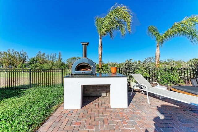 view of patio / terrace with fence and area for grilling