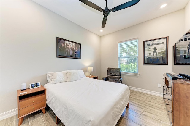 bedroom featuring light wood-style floors, recessed lighting, baseboards, and a ceiling fan