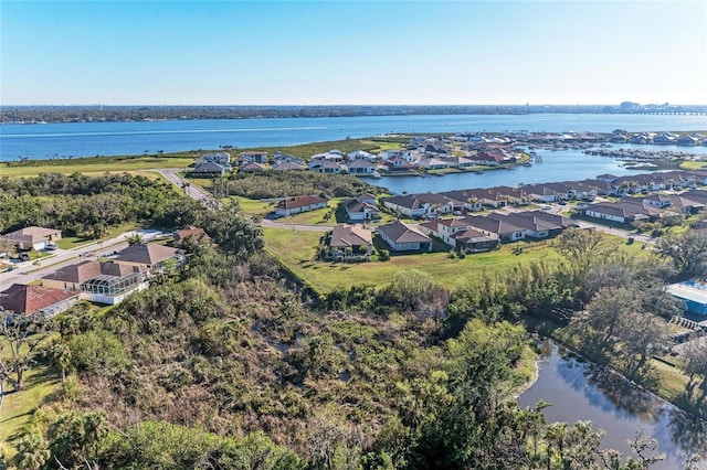 bird's eye view featuring a water view and a residential view