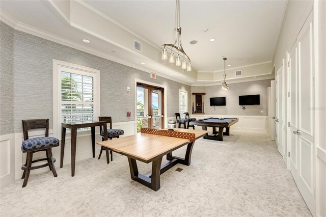 game room featuring a decorative wall, a wainscoted wall, light colored carpet, french doors, and ornamental molding